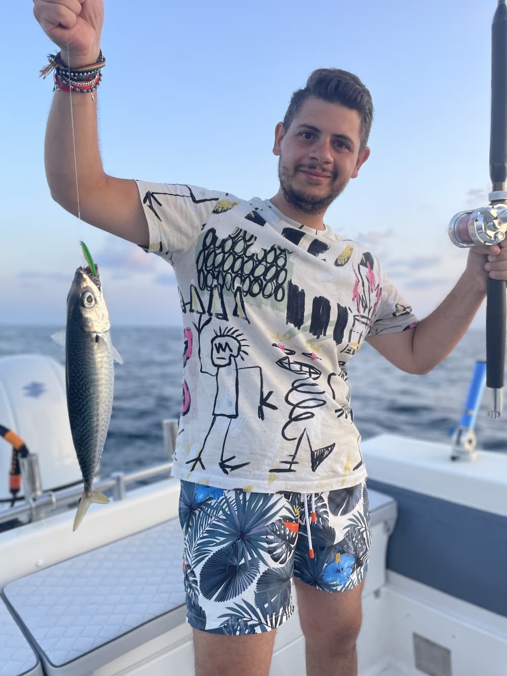 Fishing and swimming on a boat in Porto Cesareo - a private experience