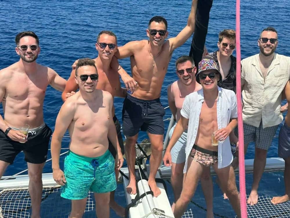 Explore Mykonos and enjoy a full day of sailing on a catamaran