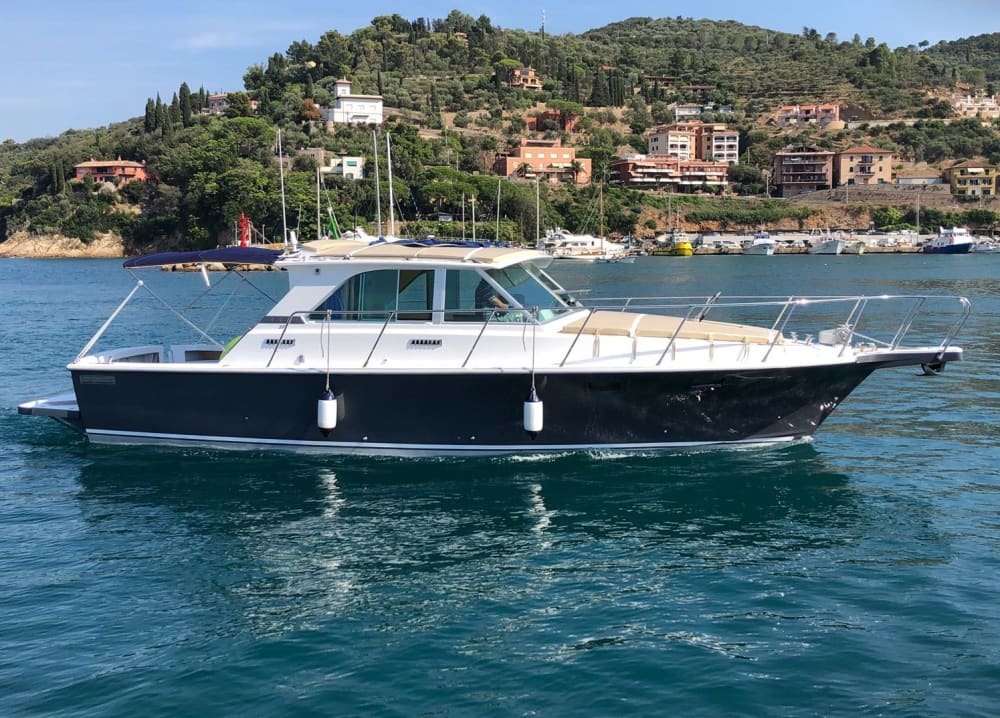 Discover Porto Santo Stefano: A full day of sun on a motorboat