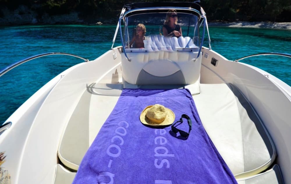 Discover Paxi on a motorboat for 9h