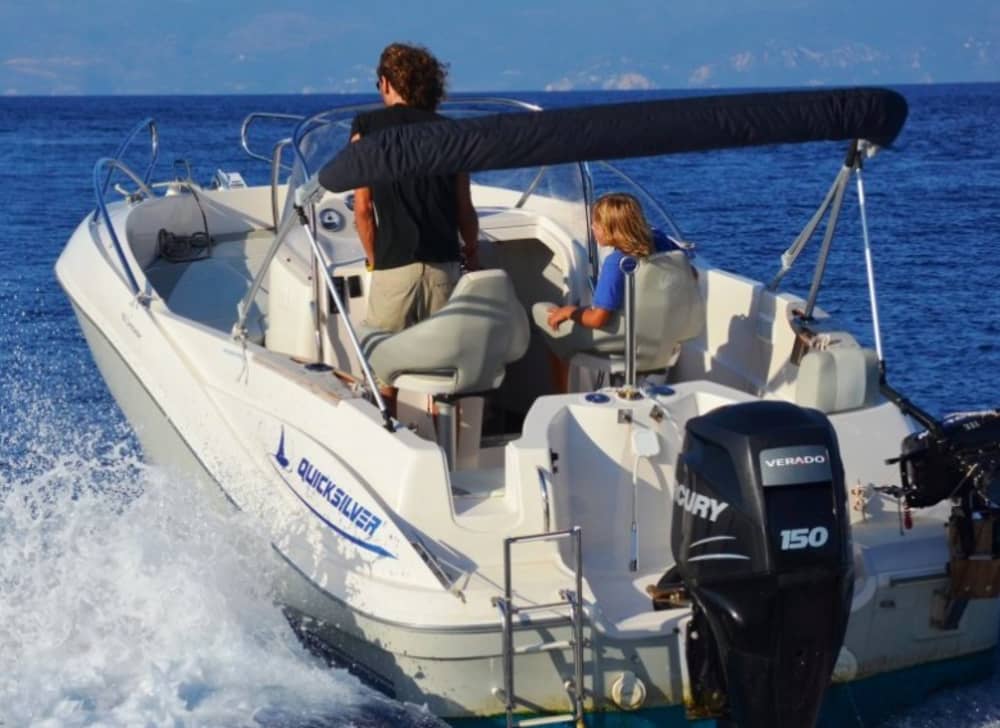 Discover Paxi on a motorboat for 9h