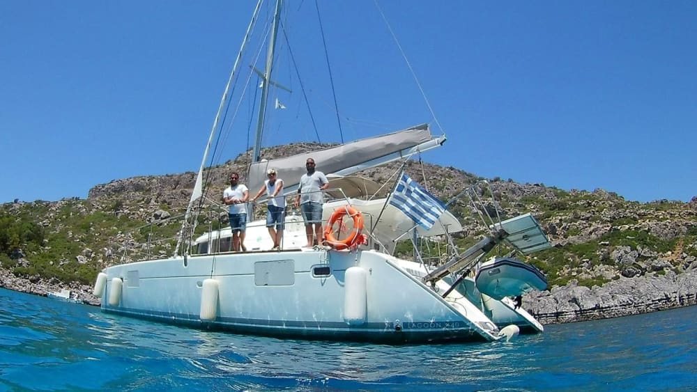 Discover Rhodes on a catamaran for a full day