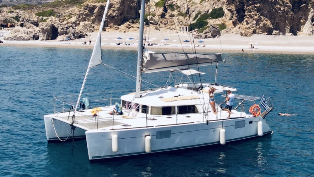 Discover Rhodes on a catamaran for a full day