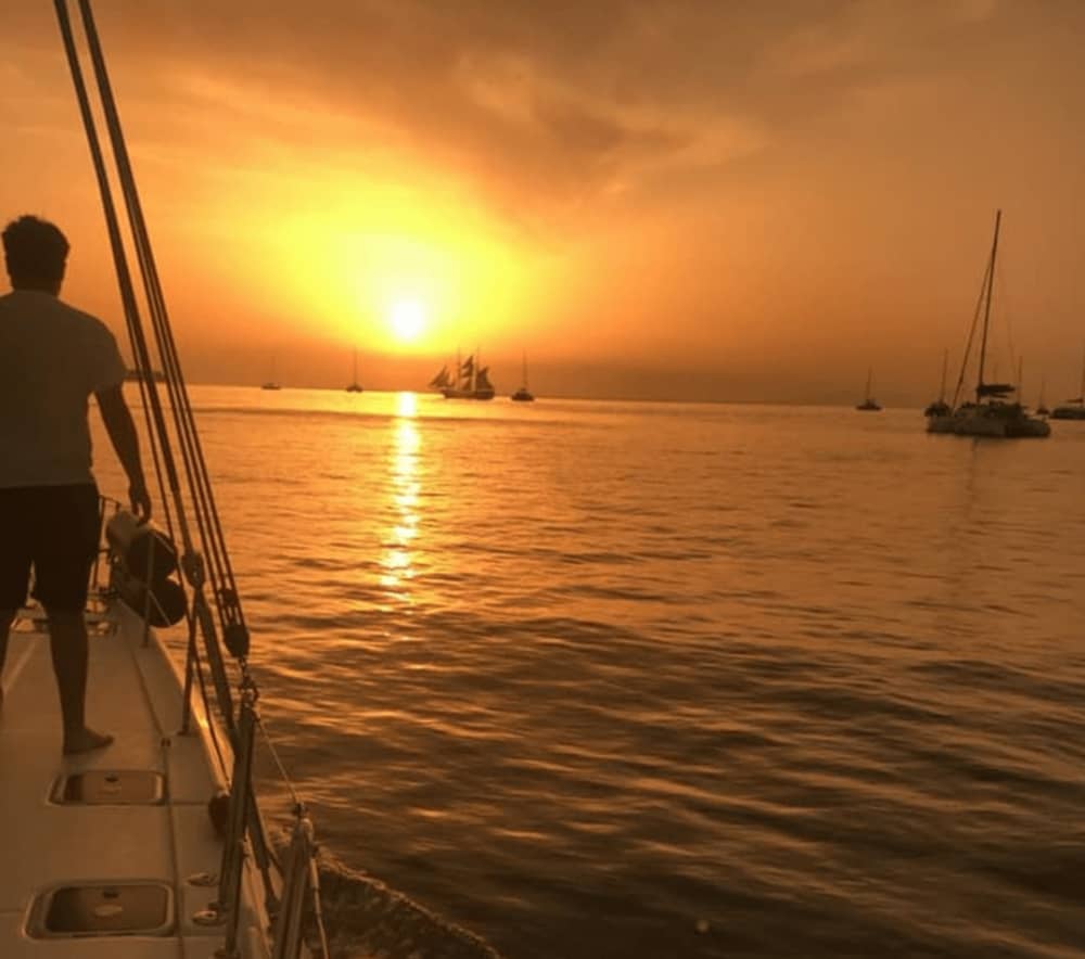 Private Sunset Catamaran Cruise with BBQ, Drinks & Transfers