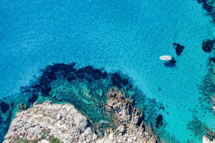 Discover Sant'Antioco on a full-day trip on a motorboat