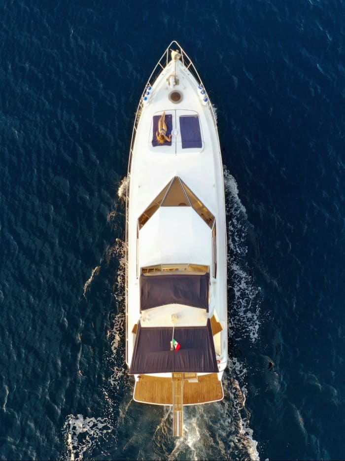 Discover Giardini Naxos on a motorboat for 8h