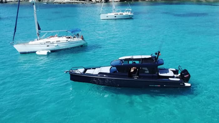 Discover Ibiza on a full-day trip on a motorboat