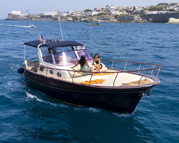 Full-day boat tour around Ischia from Forio: hidden coves, crystal-clear waters