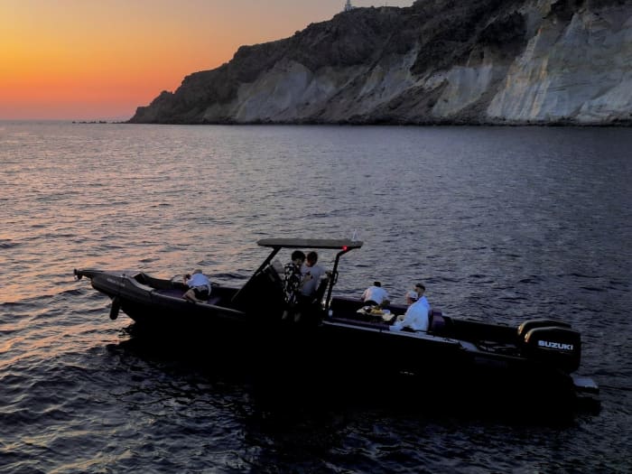Enjoy a half-day Odyssey around Santorini on a motorboat