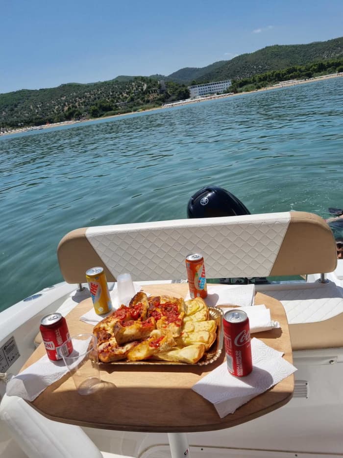 Discover Vieste's shores: A complete day trip aboard a motorboat