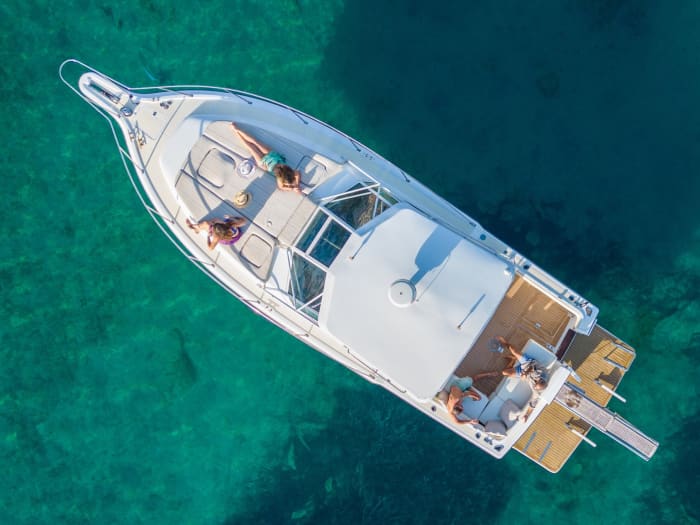 Enjoy a full day on a motorboat in Santorini