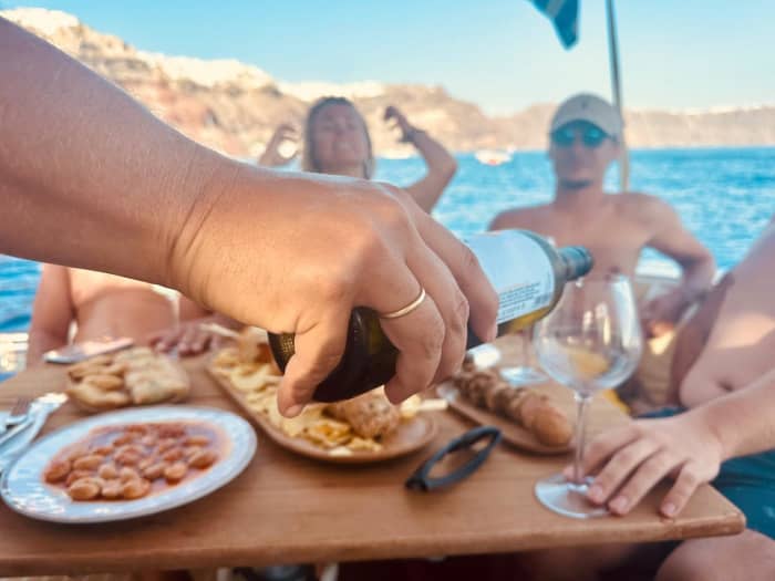 Enjoy a full day on a motorboat in Santorini