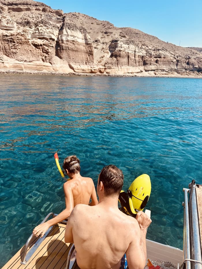 Enjoy a full day on a motorboat in Santorini