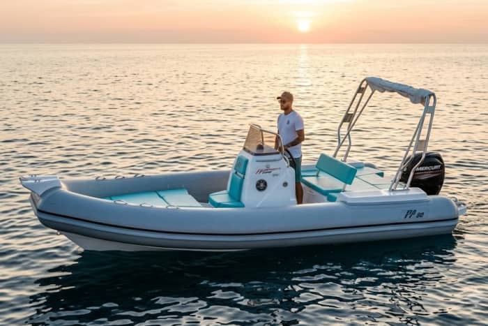 Tavolara at dusk, among golden coves and an aperitif on board from Olbia