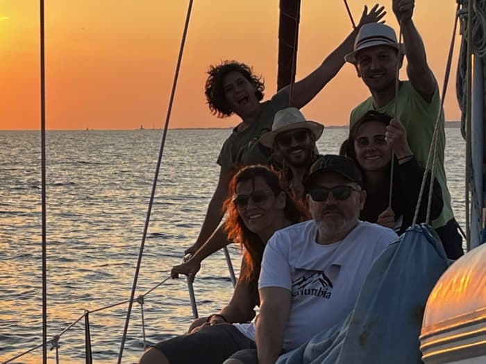 Sunset aperitif on a sailboat off the coast of Ostia