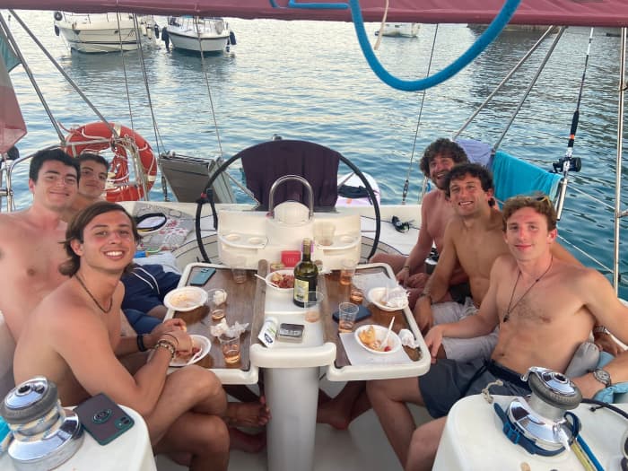 Sunset aperitif on a sailboat off the coast of Ostia