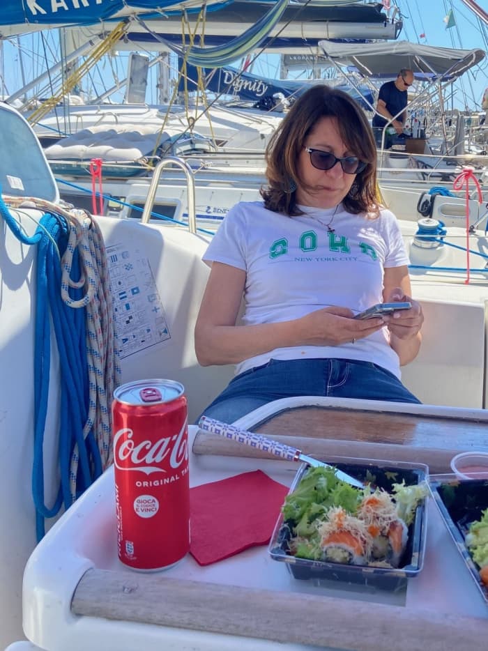 Sunset aperitif on a sailboat off the coast of Ostia