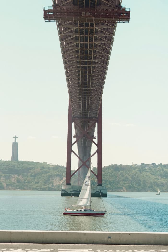 Explore Lisbon aboard a sailboat on the Tagus River, in a private sunset experience.