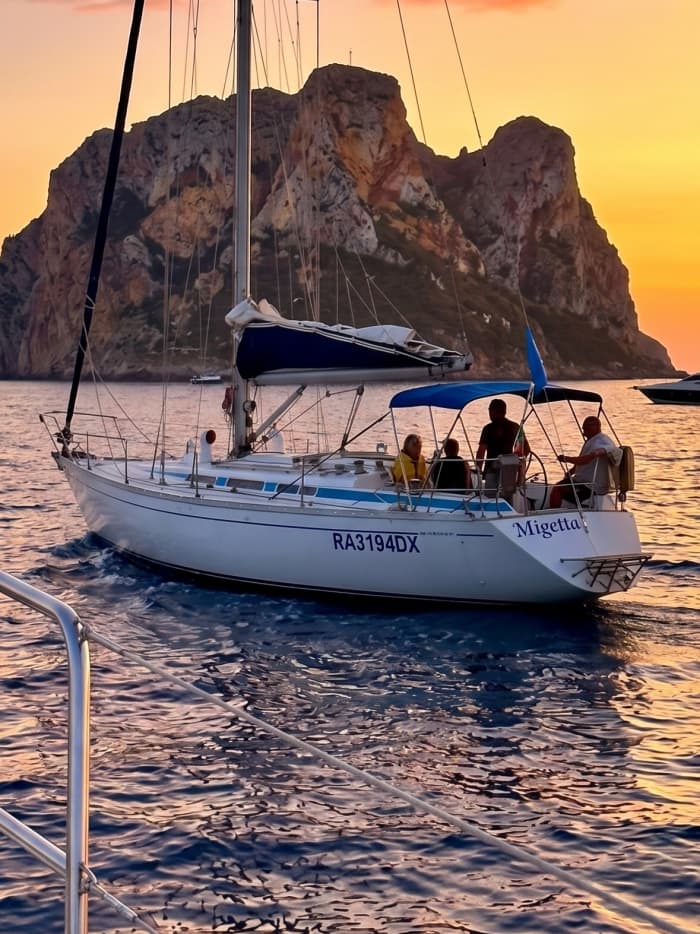 Sunset aperitif on a sailing boat in the Gulf of Cagliari