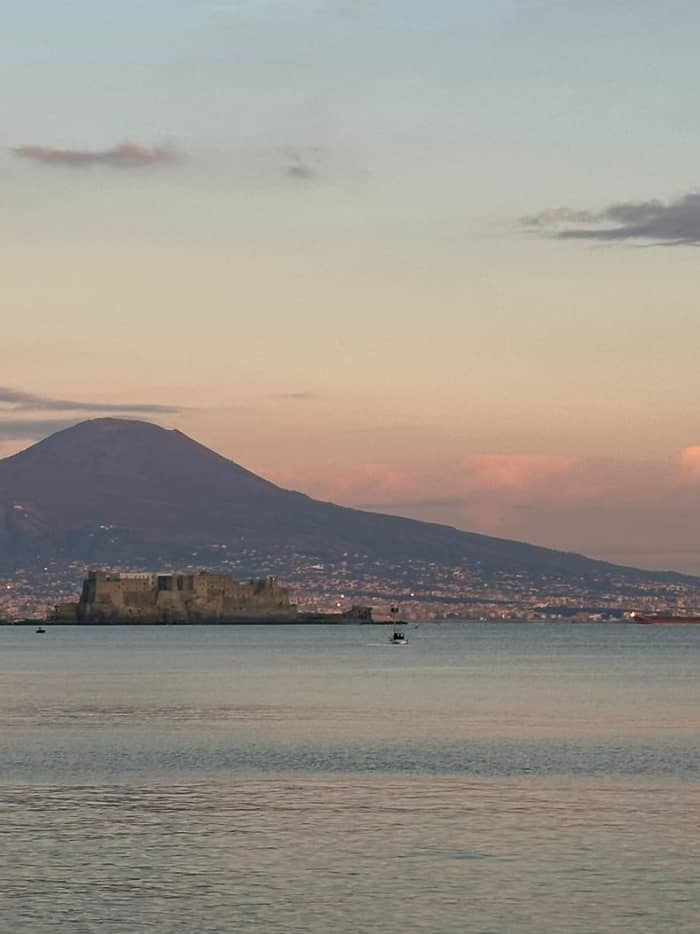 Sunset dinghy tour of Posillipo, with dinner in the Gulf of Naples overlooking Mount Vesuvius.