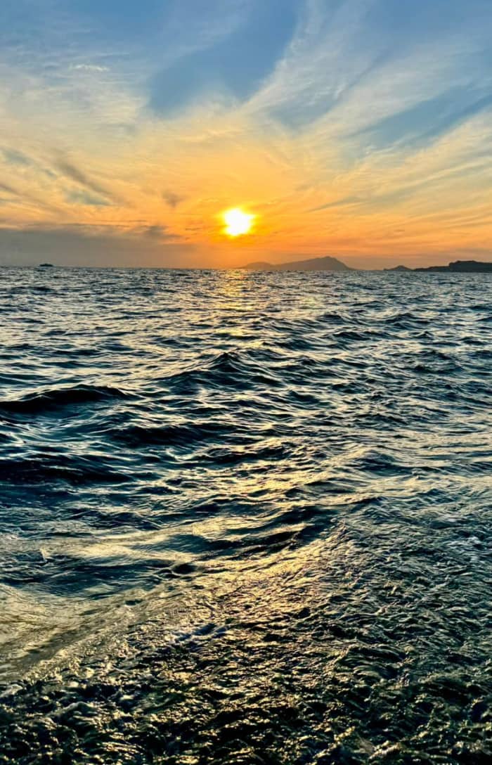 Sunset dinghy tour of Posillipo, with dinner in the Gulf of Naples overlooking Mount Vesuvius.