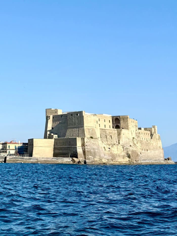 Sunset dinghy tour of Posillipo, with dinner in the Gulf of Naples overlooking Mount Vesuvius.