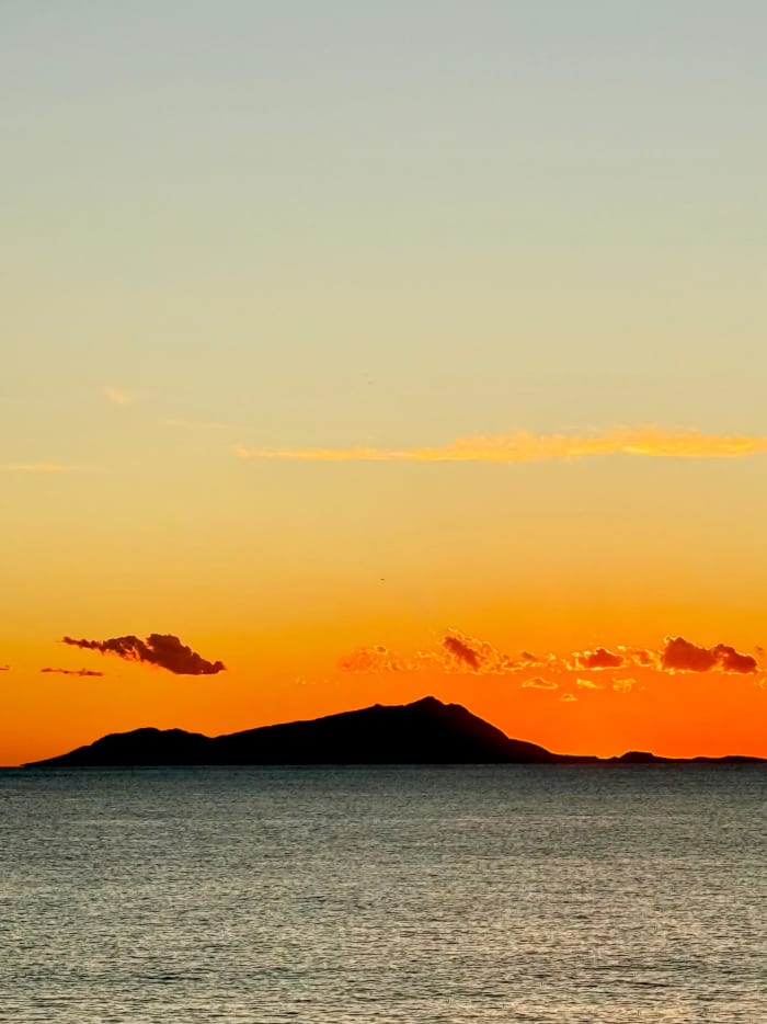 Sunset dinghy tour of Posillipo, with dinner in the Gulf of Naples overlooking Mount Vesuvius.