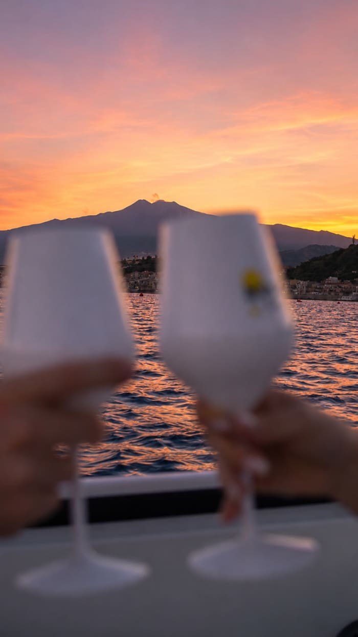 Your sunset aperitif in Taormina or among the Faraglioni of Acitrezza.