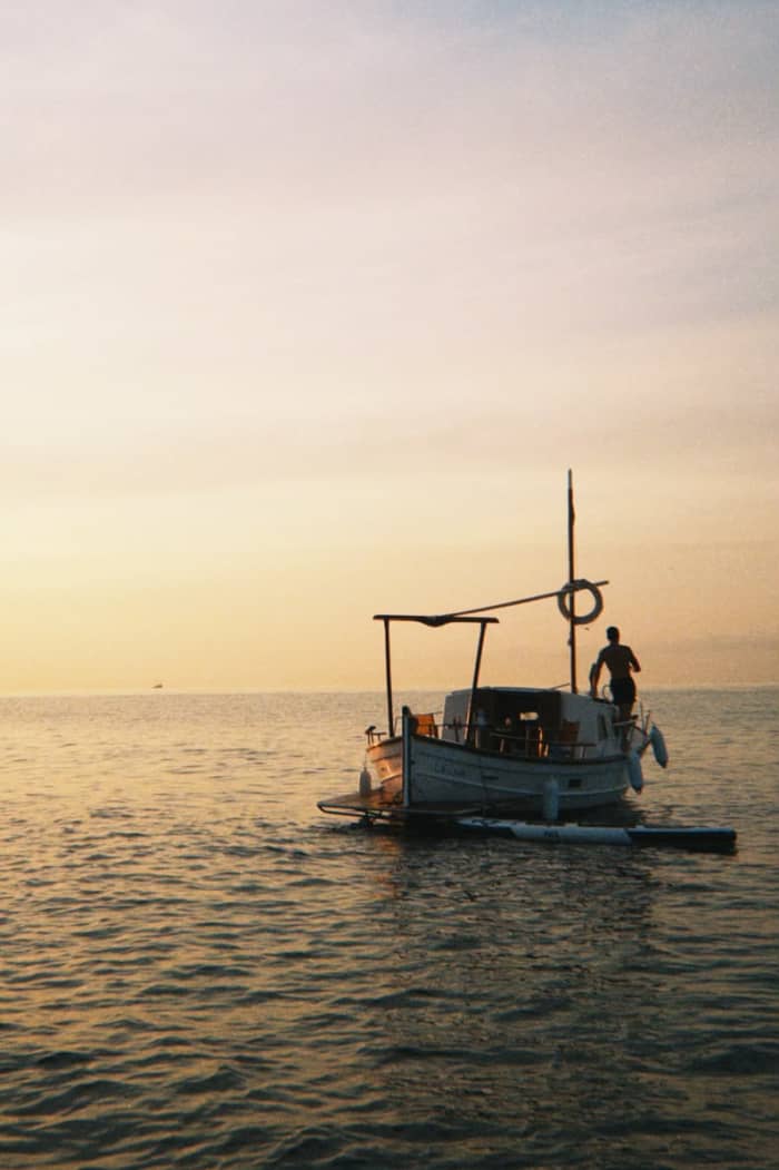 Breakfast at dawn, with views of Barcelona from the sea