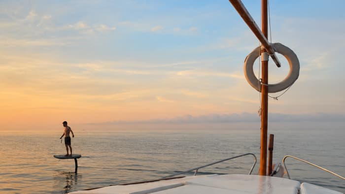 Breakfast at dawn, with views of Barcelona from the sea