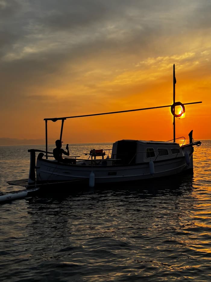 Breakfast at dawn, with views of Barcelona from the sea