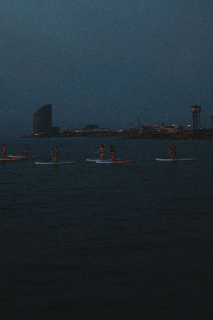 Breakfast at dawn, with views of Barcelona from the sea
