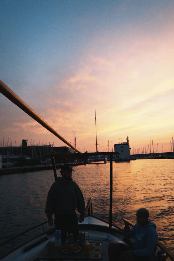 Breakfast at dawn, with views of Barcelona from the sea