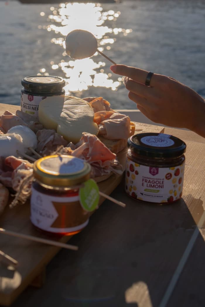 Experience Eastern Sicily from the sea: A full day tour of Taormina, the Blue Grotto, Isola Bella, or the Faraglioni rocks of Acitrezza.