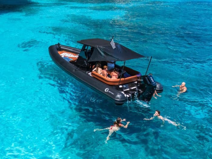Sunset on a dinghy in the Gulf of Orosei: aperitif on board and sunset coves