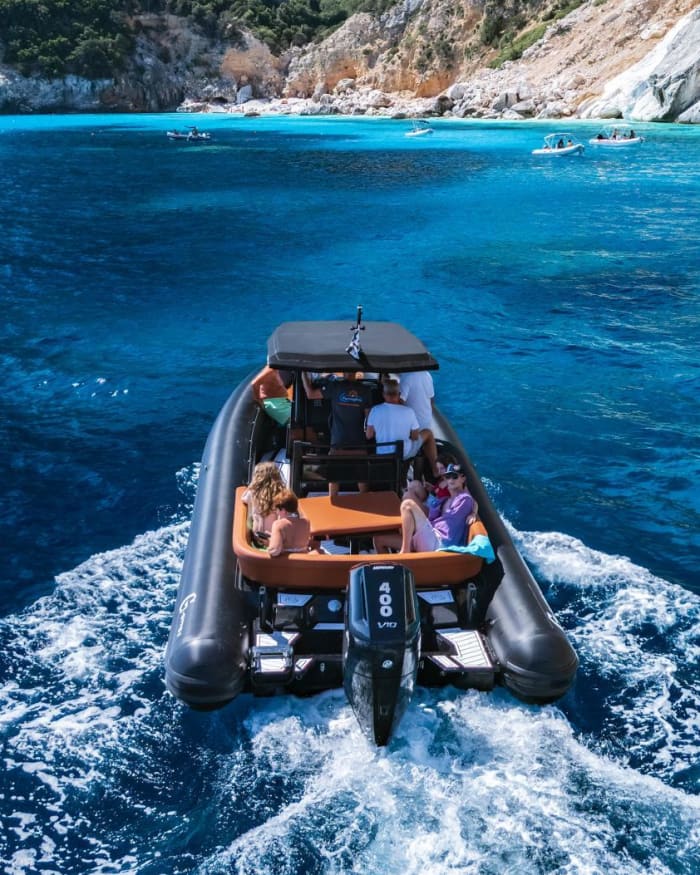 Sunset on a dinghy in the Gulf of Orosei: aperitif on board and sunset coves