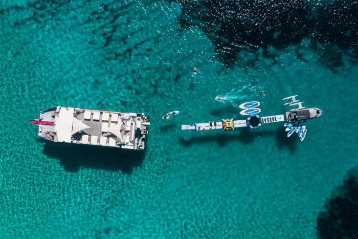 Full-Day Private Charter aboard a Floating Beach Club Catamaran · Ibiza & Formentera