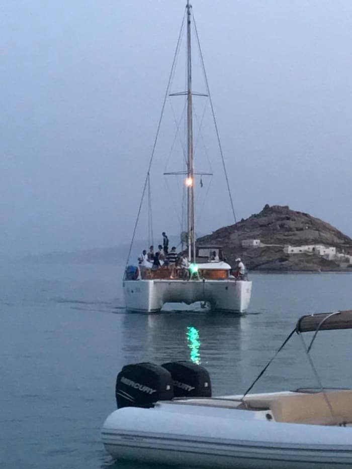 Explore Mykonos and enjoy a full day of sailing on a catamaran