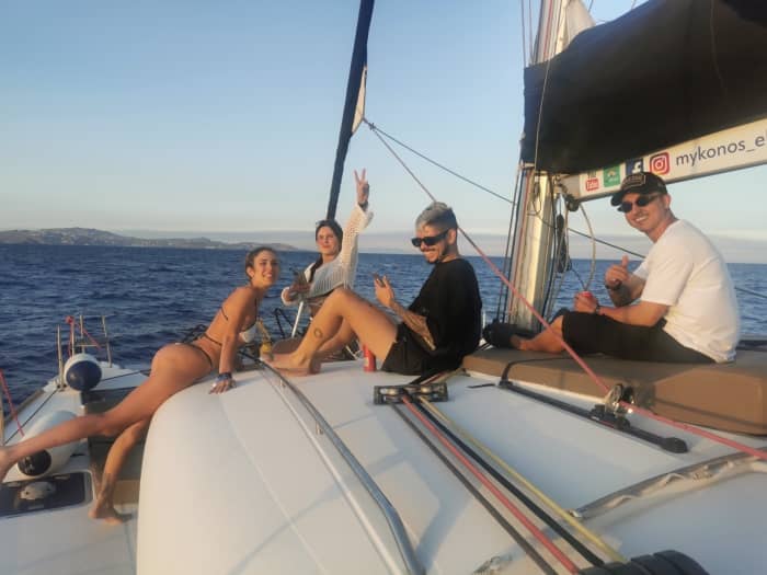 Explore Mykonos and enjoy a full day of sailing on a catamaran