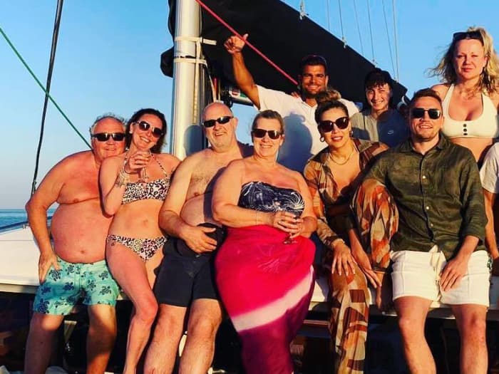 Explore Mykonos and enjoy a full day of sailing on a catamaran