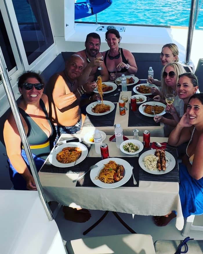Explore Mykonos and enjoy a full day of sailing on a catamaran