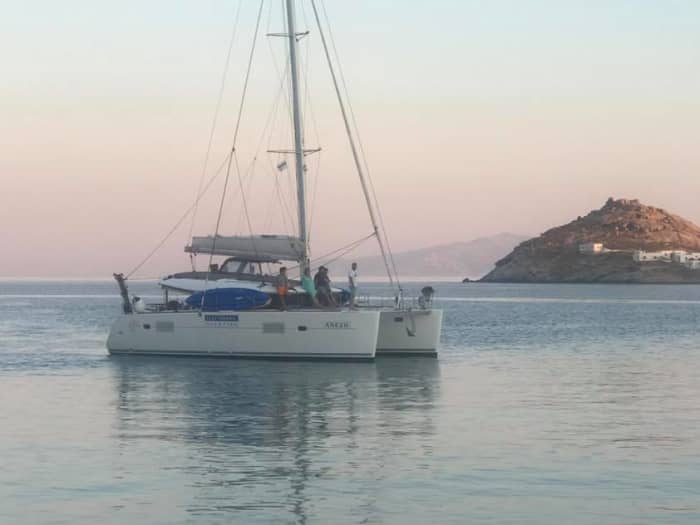 Explore Mykonos and enjoy a full day of sailing on a catamaran
