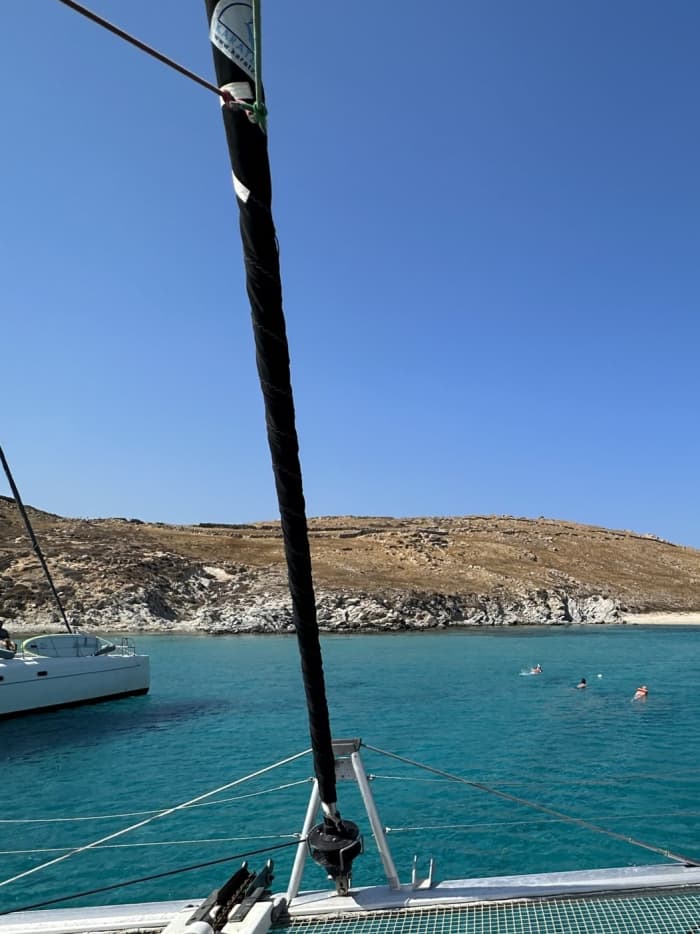Explore Mykonos and enjoy a full day of sailing on a catamaran
