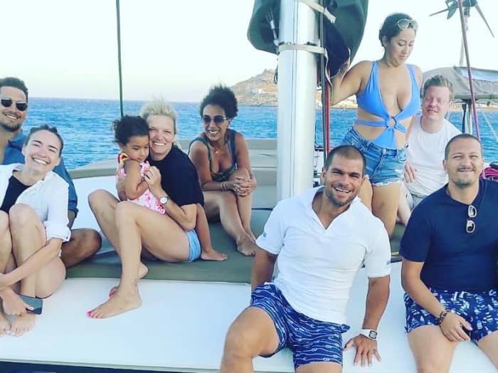 Explore Mykonos and enjoy a full day of sailing on a catamaran