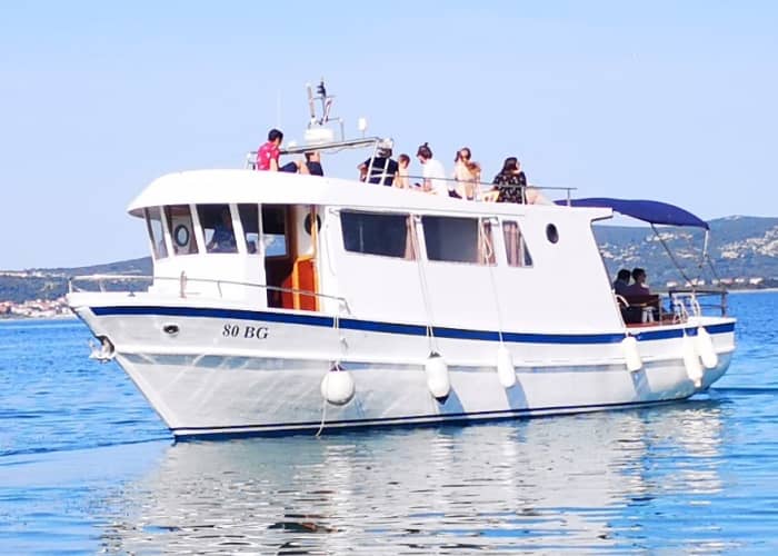 Discover Biograd na Moru's shores: A complete day trip aboard a motorboat