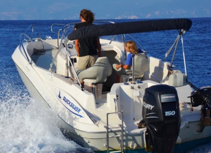 Discover Paxi on a motorboat for 9h