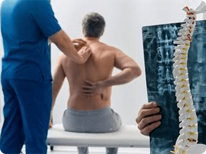 Doctor examining a patient's spine
