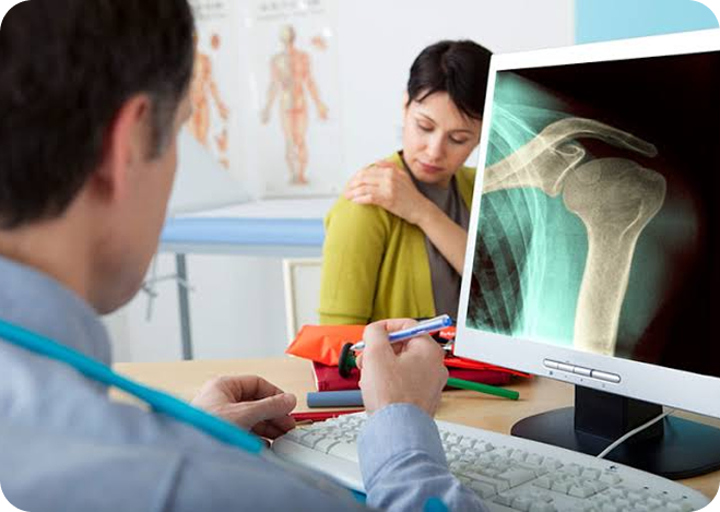 Doctor reviewing an X-ray with a patient
