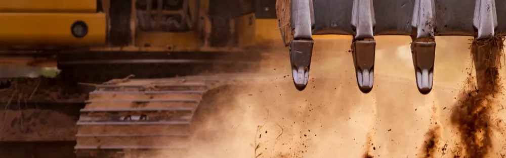 excavator rental digging up dirt