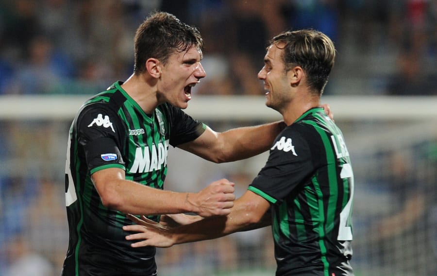 Giangiacomo Magnani and Pol Lirola celebrate